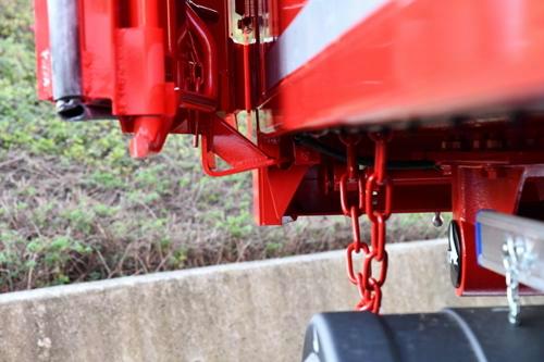 Door opener with quick-release fastener for carriage doors